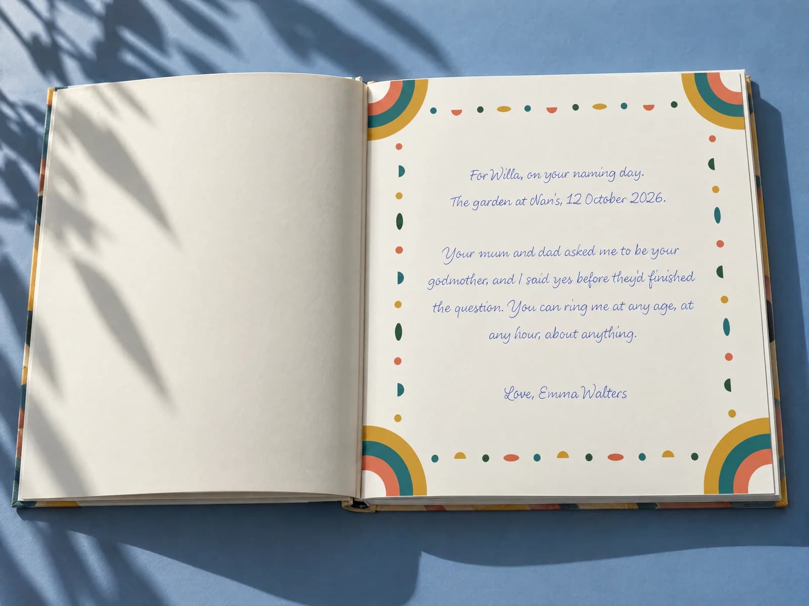 The dedication page of an open hardcover picture book, resting on linen
